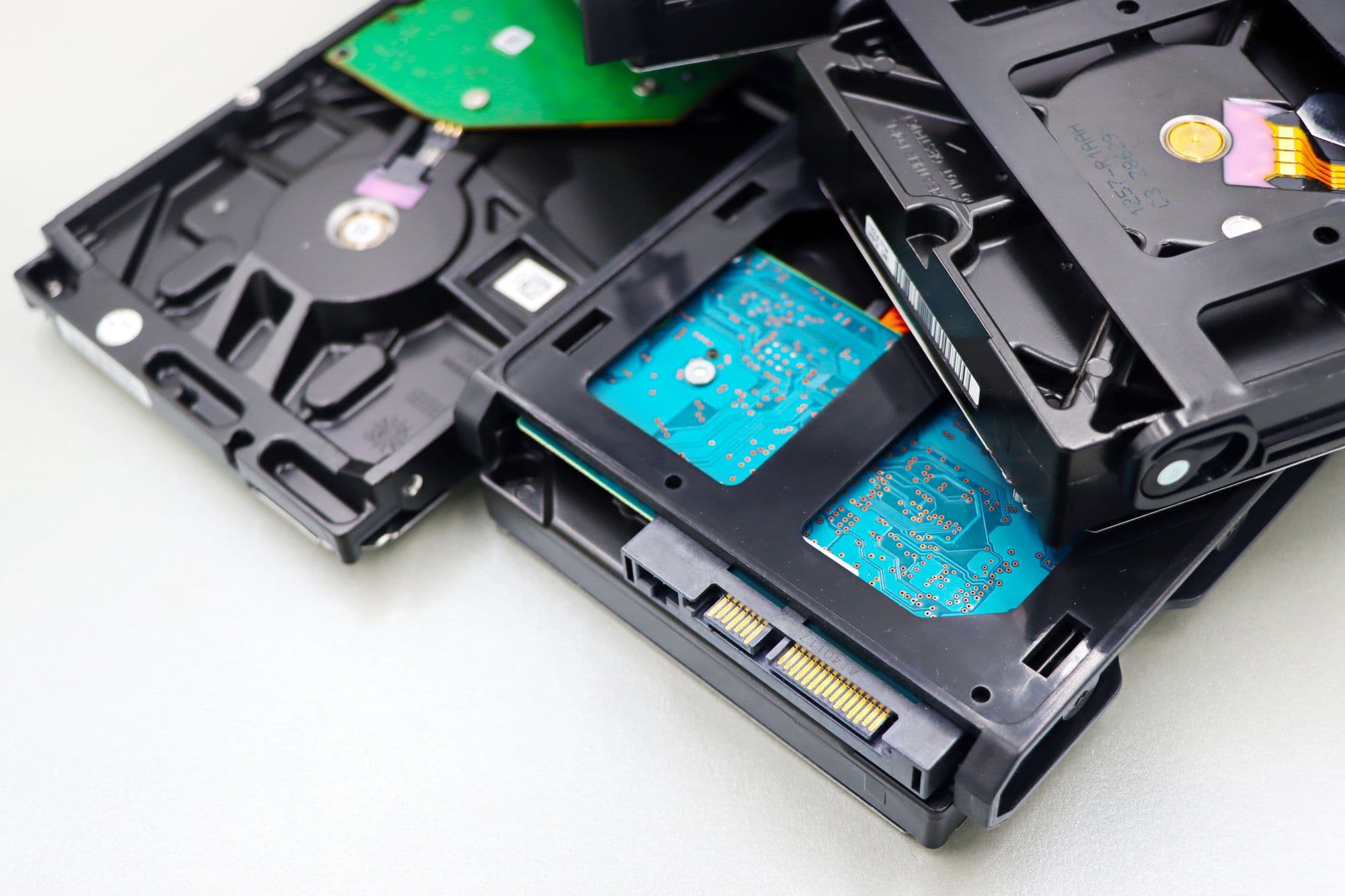 Stack of 3.5-inch hard disk drives seen from the circuit board side