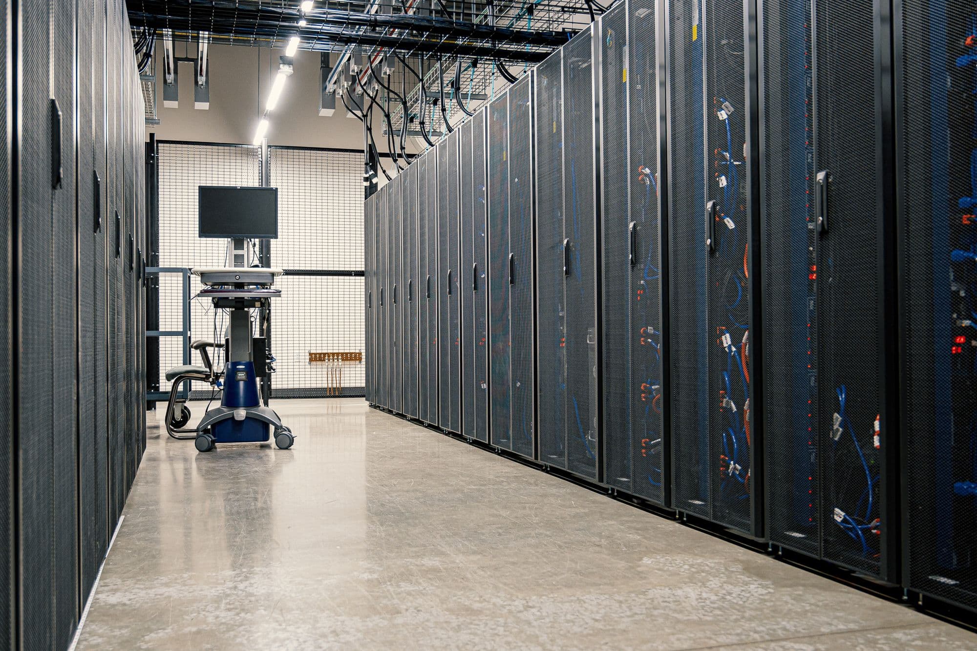 Aisle of server and storage cabinets in a modern data center