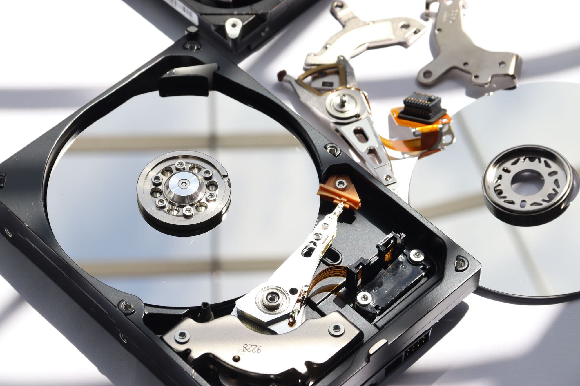Opened hard disk drive with its platters and read/write arm exposed